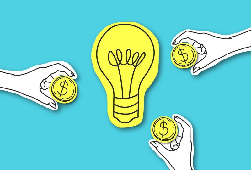 Perspective way to invest money. Hands with dollar sign coins around yellow light bulb over blue background